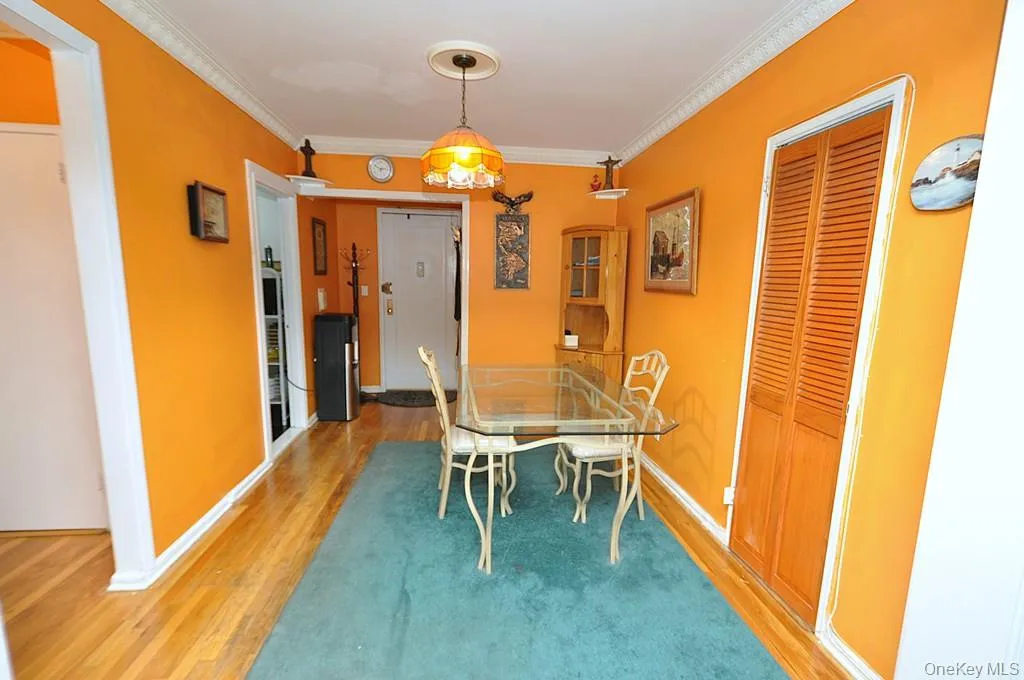 The dining area opens to the living room and has hardwood floors. The dining area opens to the living room and has hardwood floors.