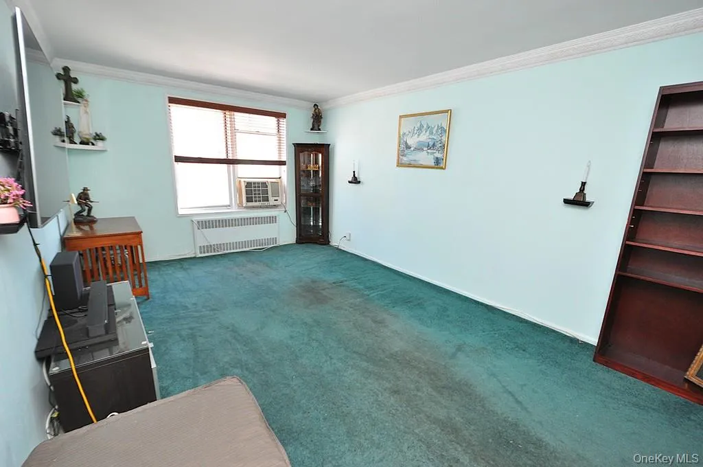 The bright and airy living room opens to the Dining foyer and has covered hardwood floors. The bright and airy living room opens to the Dining foyer and has covered hardwood floors.