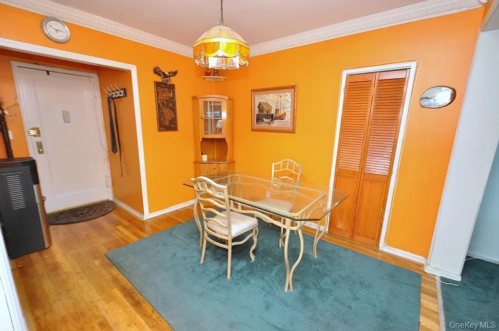 The dining area opens to the living room and has hardwood floors. The dining area opens to the living room and has hardwood floors.