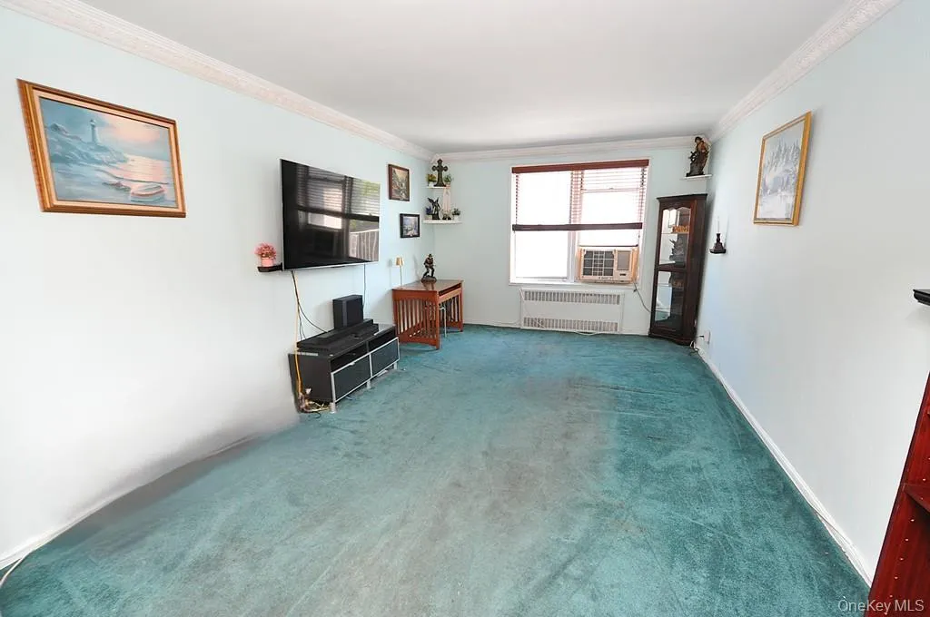 The bright and airy living room opens to the Dining foyer and has covered hardwood floors. The bright and airy living room opens to the Dining foyer and has covered hardwood floors.