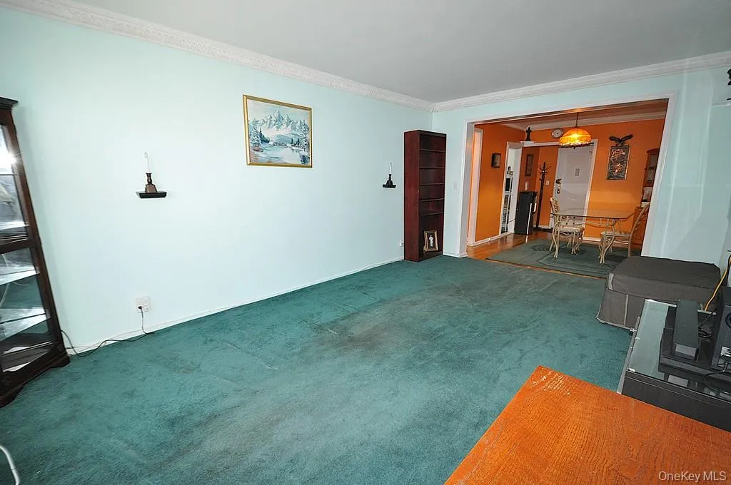 The bright and airy living room opens to the Dining foyer and has covered hardwood floors. The bright and airy living room opens to the Dining foyer and has covered hardwood floors.