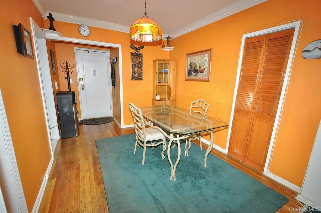 The dining area opens to the living room and has hardwood floors. The dining area opens to the living room and has hardwood floors.