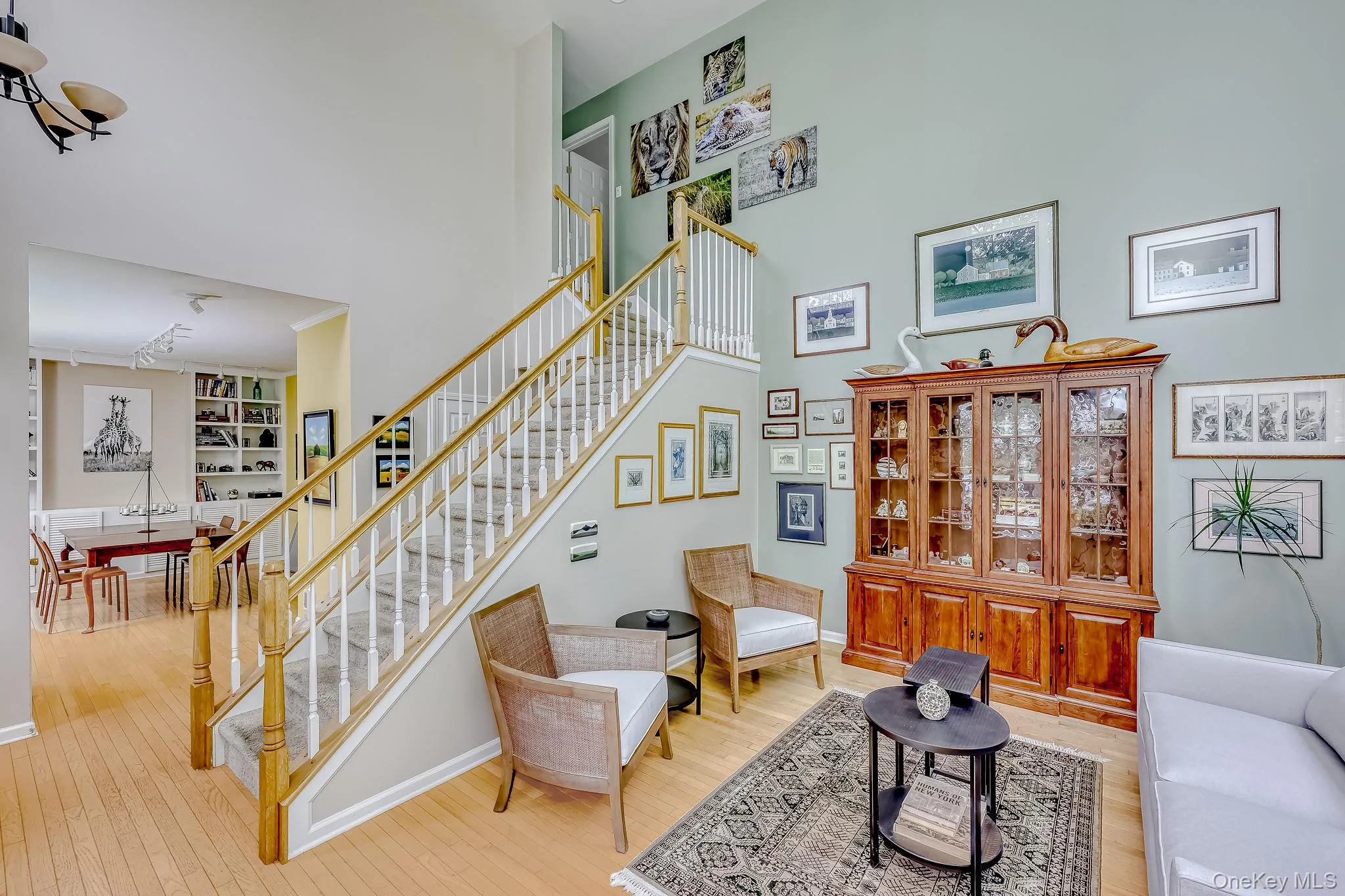 Spacious living room with staircase to upper level Spacious living room with staircase to upper level