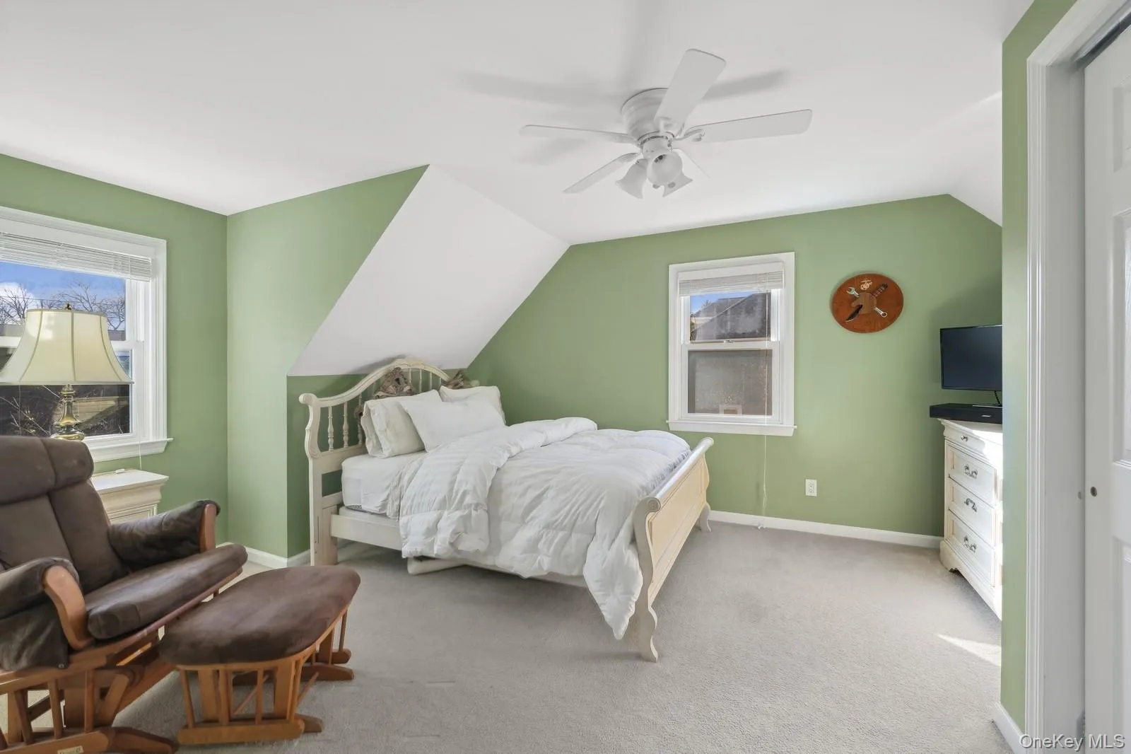 Carpeted bedroom featuring a closet, ceiling fan, and lofted ceiling Carpeted bedroom featuring a closet, ceiling fan, and lofted ceiling