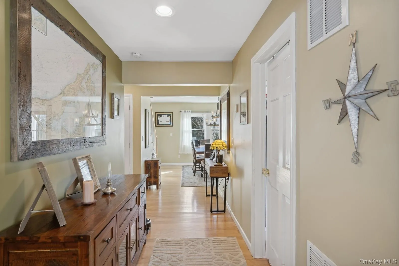 Hall with light hardwood / wood-style floors Hall with light hardwood / wood-style floors