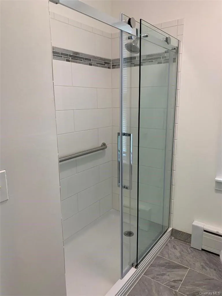 There's an oversized walk in shower stall There's an oversized walk in shower stall