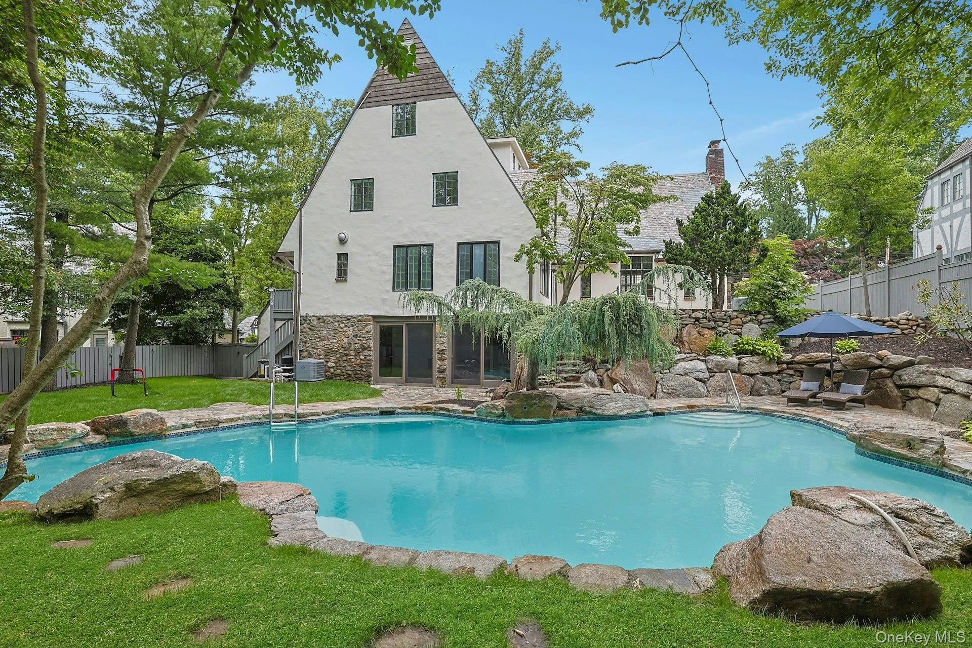 With its picturesque Tudor architecture, sparkling saltwater pool, and beautifully curated landscape, this remarkable property offers a rare blend of character, privacy, and resort-inspired outdoor living. With its picturesque Tudor architecture, sparkling saltwater pool, and beautifully curated landscape, this remarkable property offers a rare blend of character, privacy, and resort-inspired outdoor living.