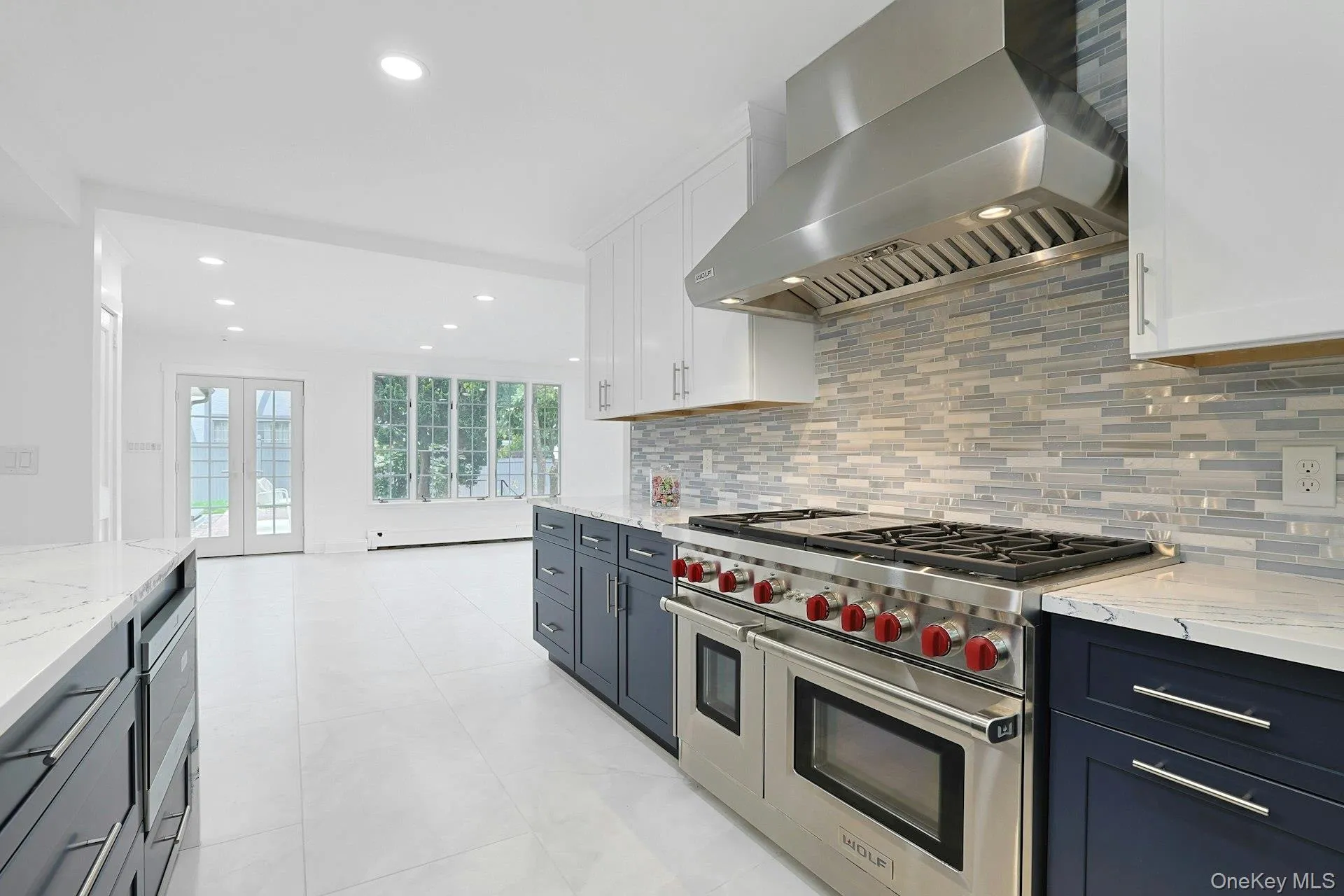 Designed for both serious cooking and effortless entertaining, the kitchen opens directly to the expansive family room, where French doors invite you outdoors to the patio and pool beyond. Designed for both serious cooking and effortless entertaining, the kitchen opens directly to the expansive family room, where French doors invite you outdoors to the patio and pool beyond.