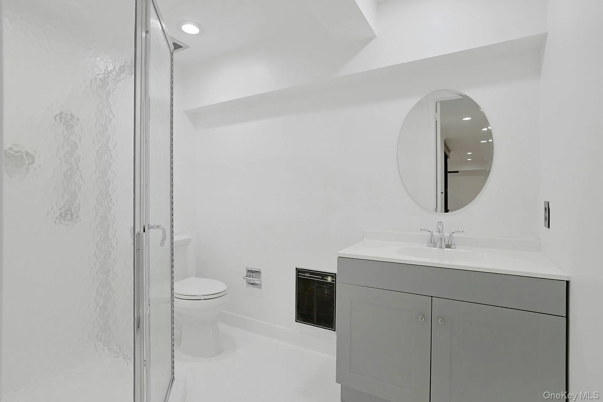Beautifully renovated, the lower-level full bath features clean contemporary finishes, a spacious walk-in shower, and a contemporary vanity, providing convenience and comfort for guests, pool-goers, and everyday living. Beautifully renovated, the lower-level full bath features clean contemporary finishes, a spacious walk-in shower, and a contemporary vanity, providing convenience and comfort for guests, pool-goers, and everyday living.