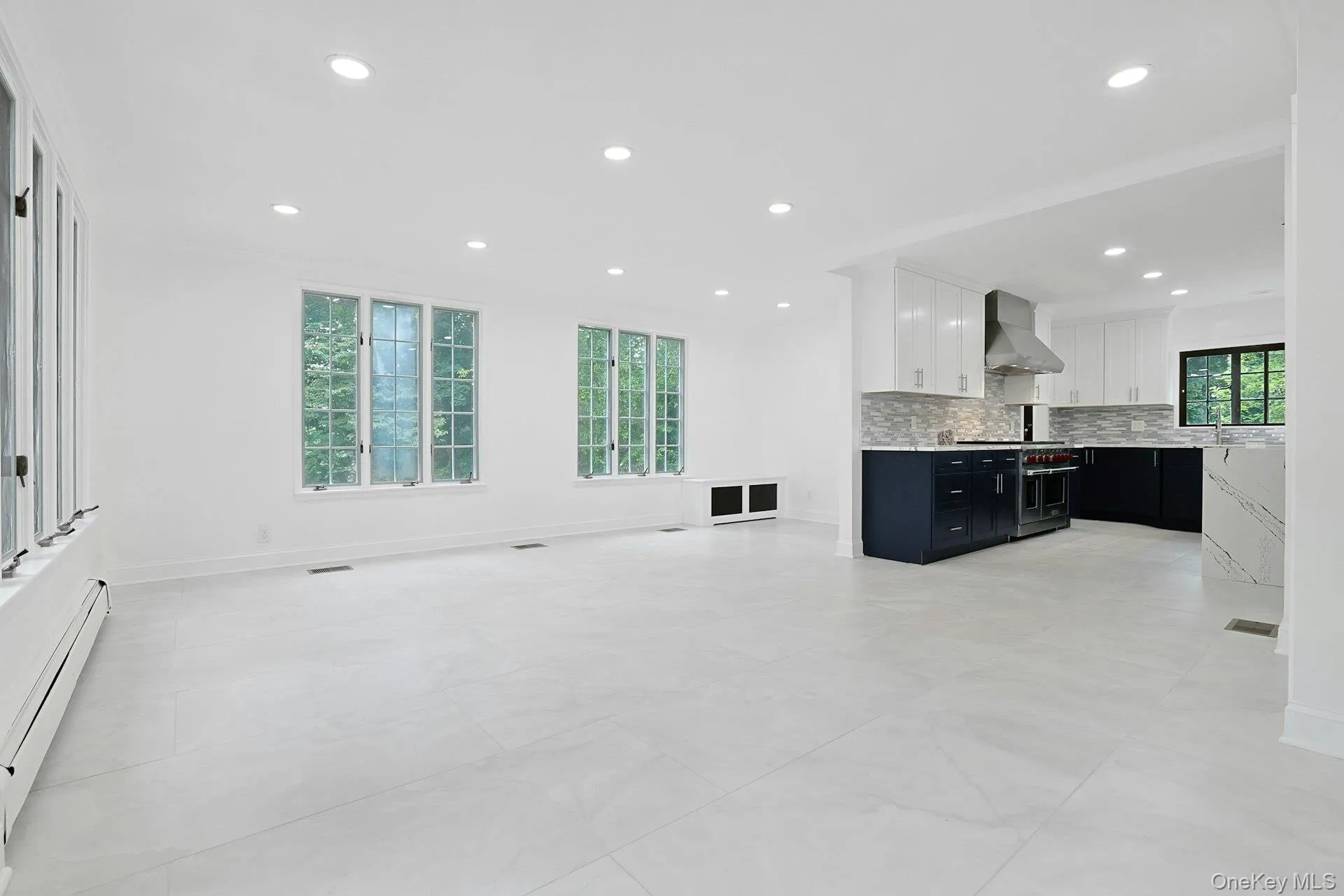 Open to the kitchen and surrounded by windows, the expansive family room offers a bright and welcoming space for everyday living while enjoying picturesque views of the backyard. Open to the kitchen and surrounded by windows, the expansive family room offers a bright and welcoming space for everyday living while enjoying picturesque views of the backyard.