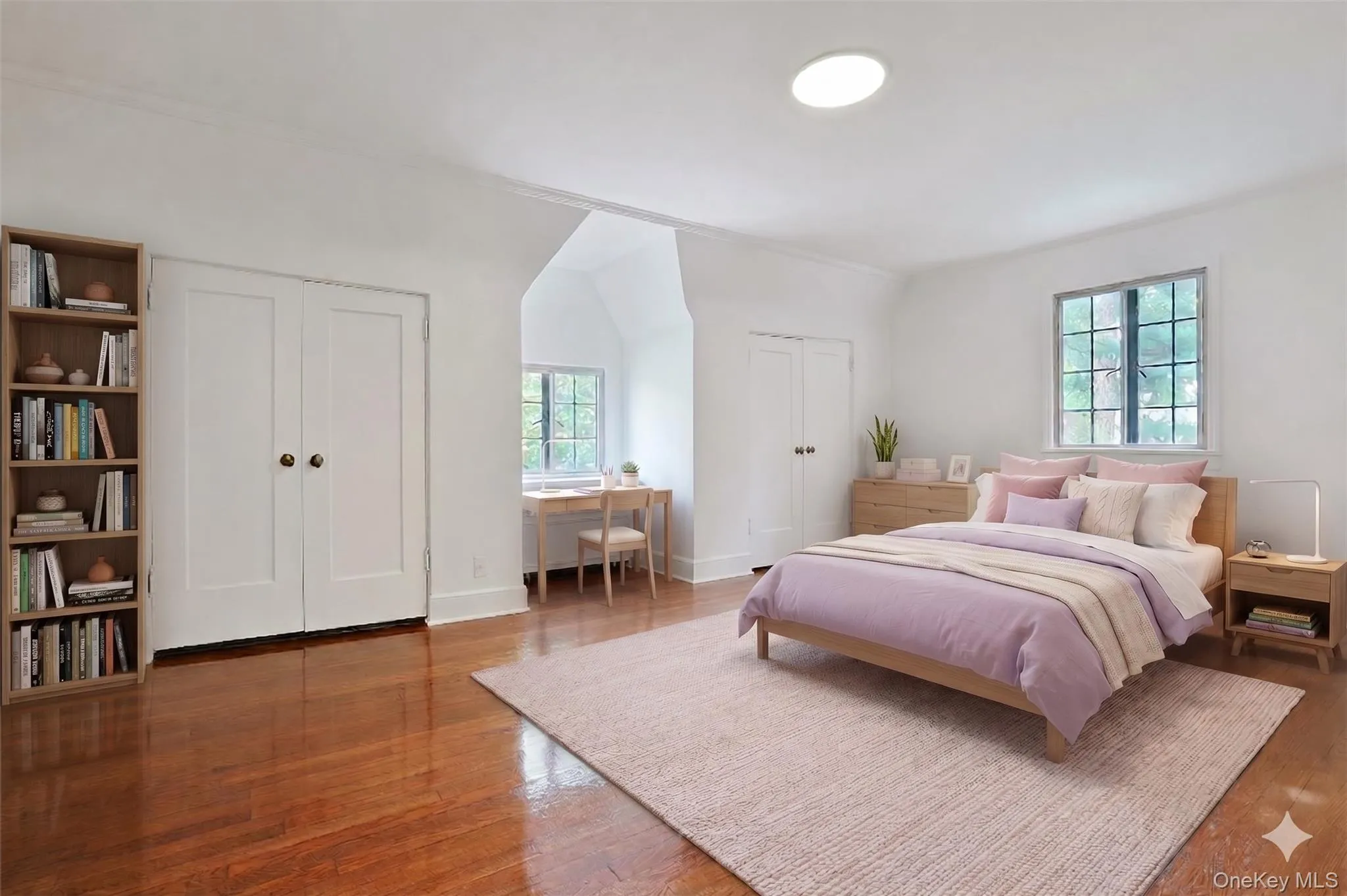 Classic Tudor charm meets modern comfort in this spacious bedroom, where a delightful dormer window, gleaming hardwood floors, and ample closet space create a warm and welcoming retreat. (Virtually Staged) Classic Tudor charm meets modern comfort in this spacious bedroom, where a delightful dormer window, gleaming hardwood floors, and ample closet space create a warm and welcoming retreat. (Virtually Staged)