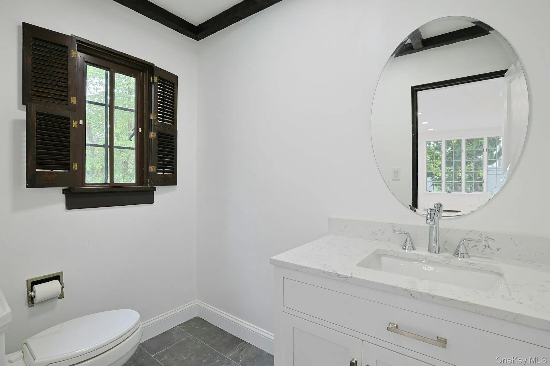 Thoughtfully renovated, the chic powder room combines timeless finishes with contemporary style for guests and everyday convenience. Thoughtfully renovated, the chic powder room combines timeless finishes with contemporary style for guests and everyday convenience.