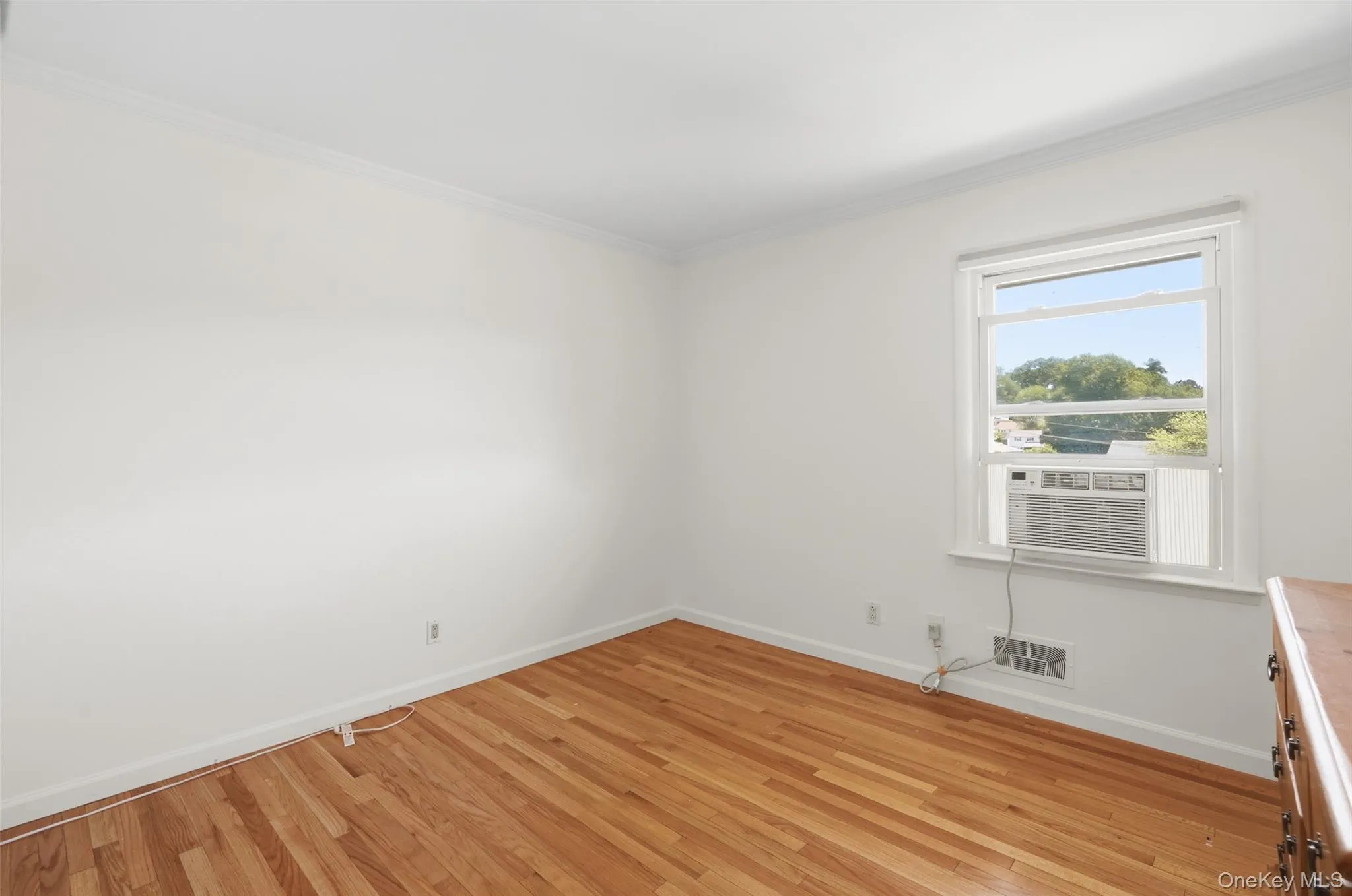 Bedroom 1 with window air conditioner. Bedroom 1 with window air conditioner.