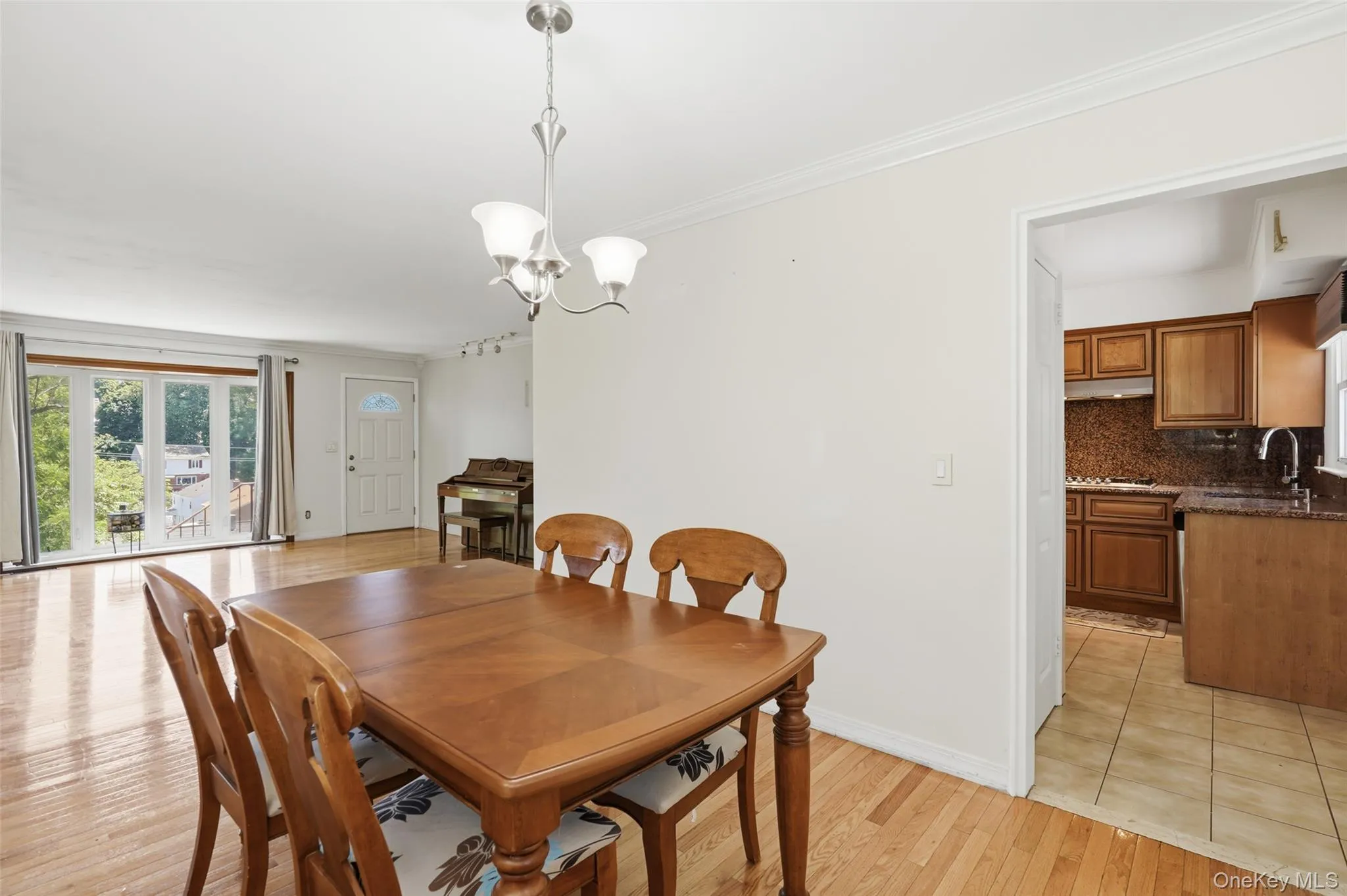 Living room has large picture window allowing for bright morning sunlight. Living room has large picture window allowing for bright morning sunlight.