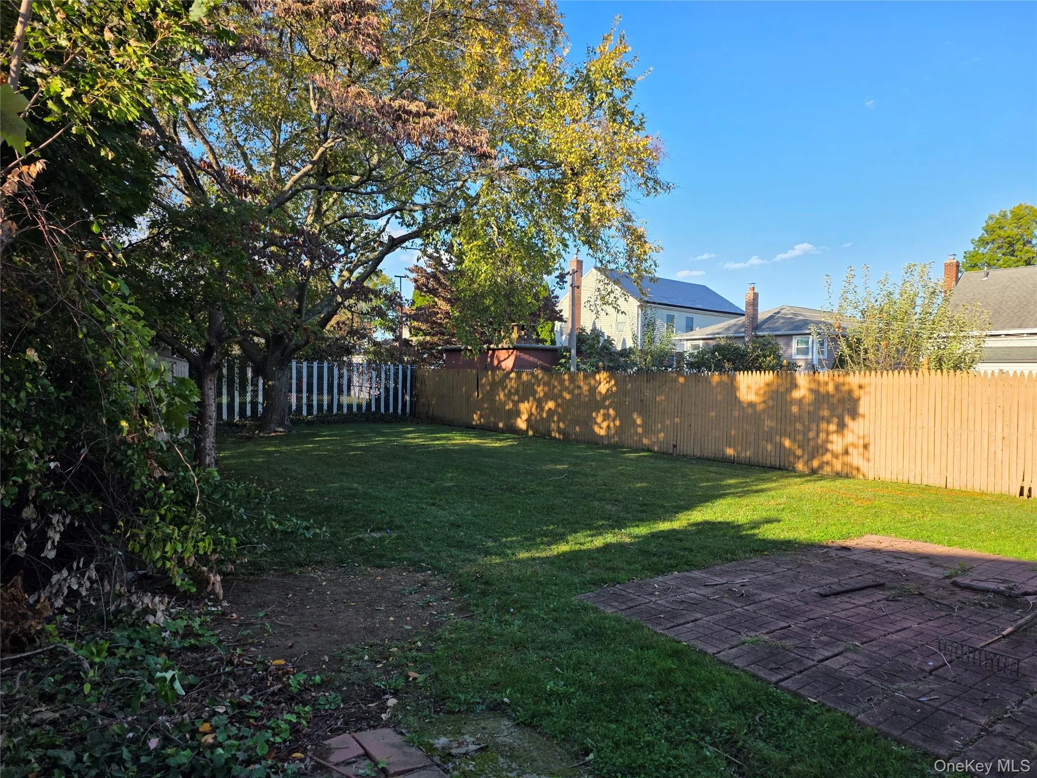 Fenced backyard featuring a patio area Fenced backyard featuring a patio area