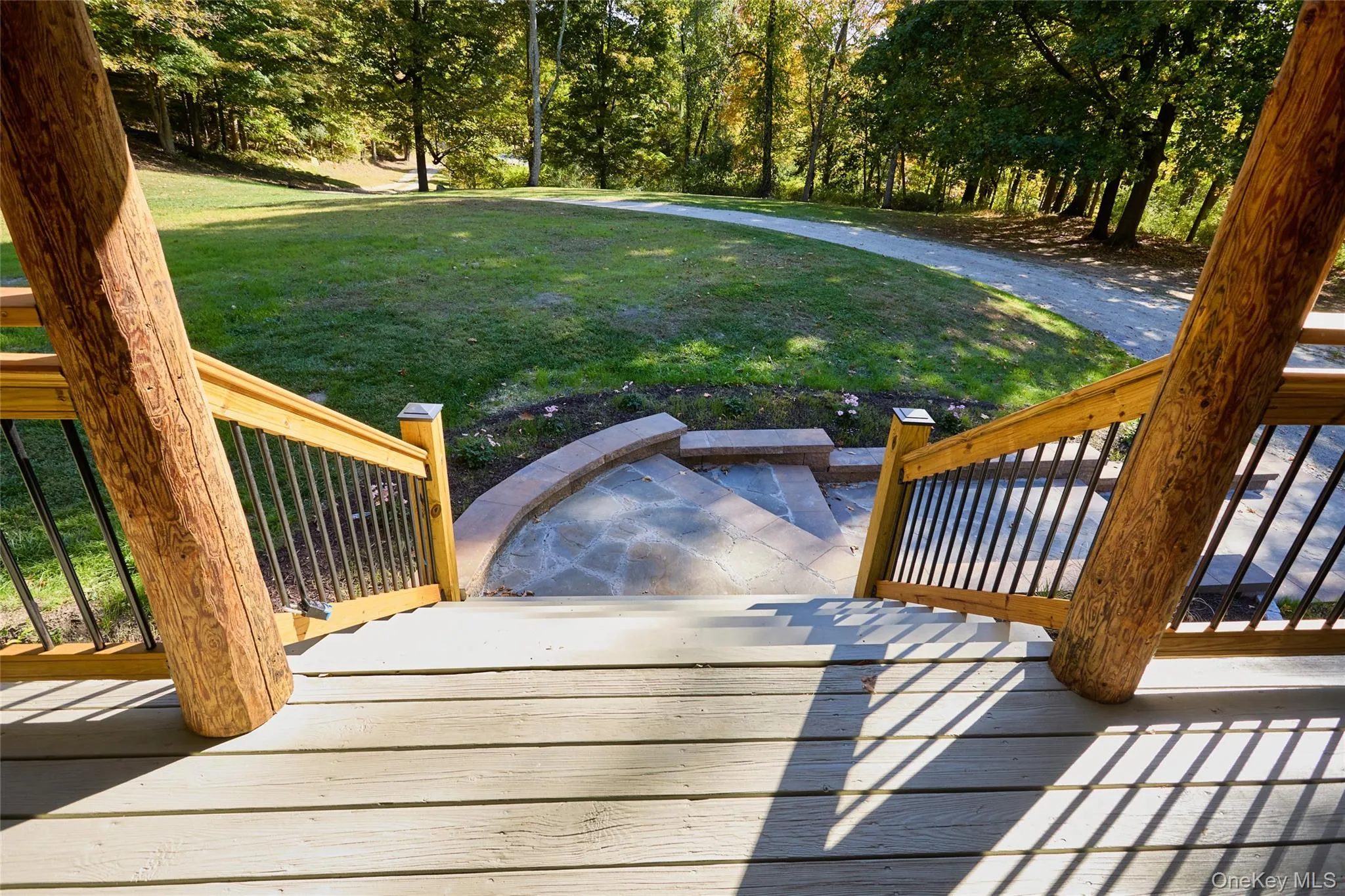 View of grassy yard with stairway and a deck View of grassy yard with stairway and a deck