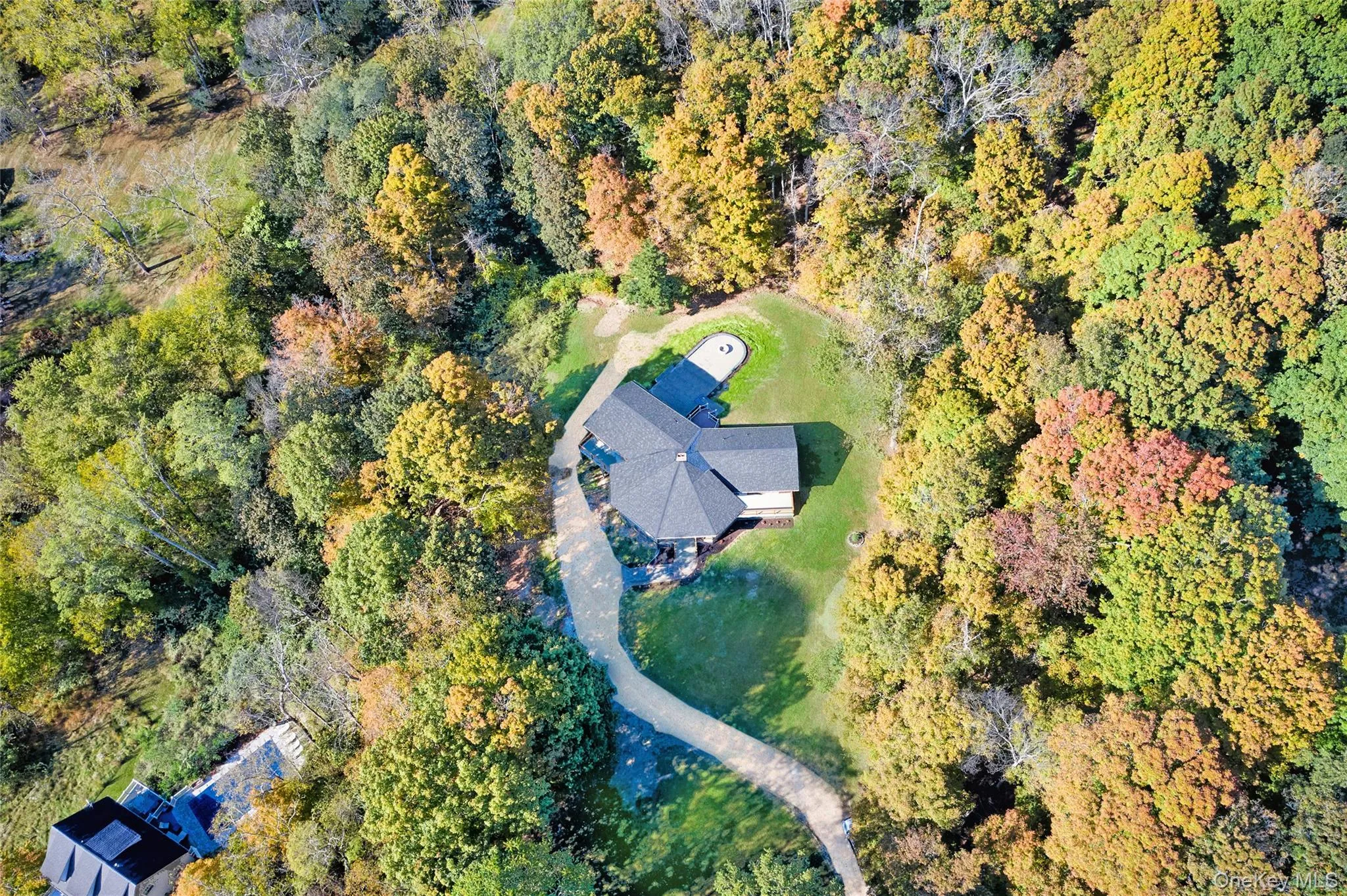 Aerial view of property's location featuring a heavily wooded area Aerial view of property's location featuring a heavily wooded area
