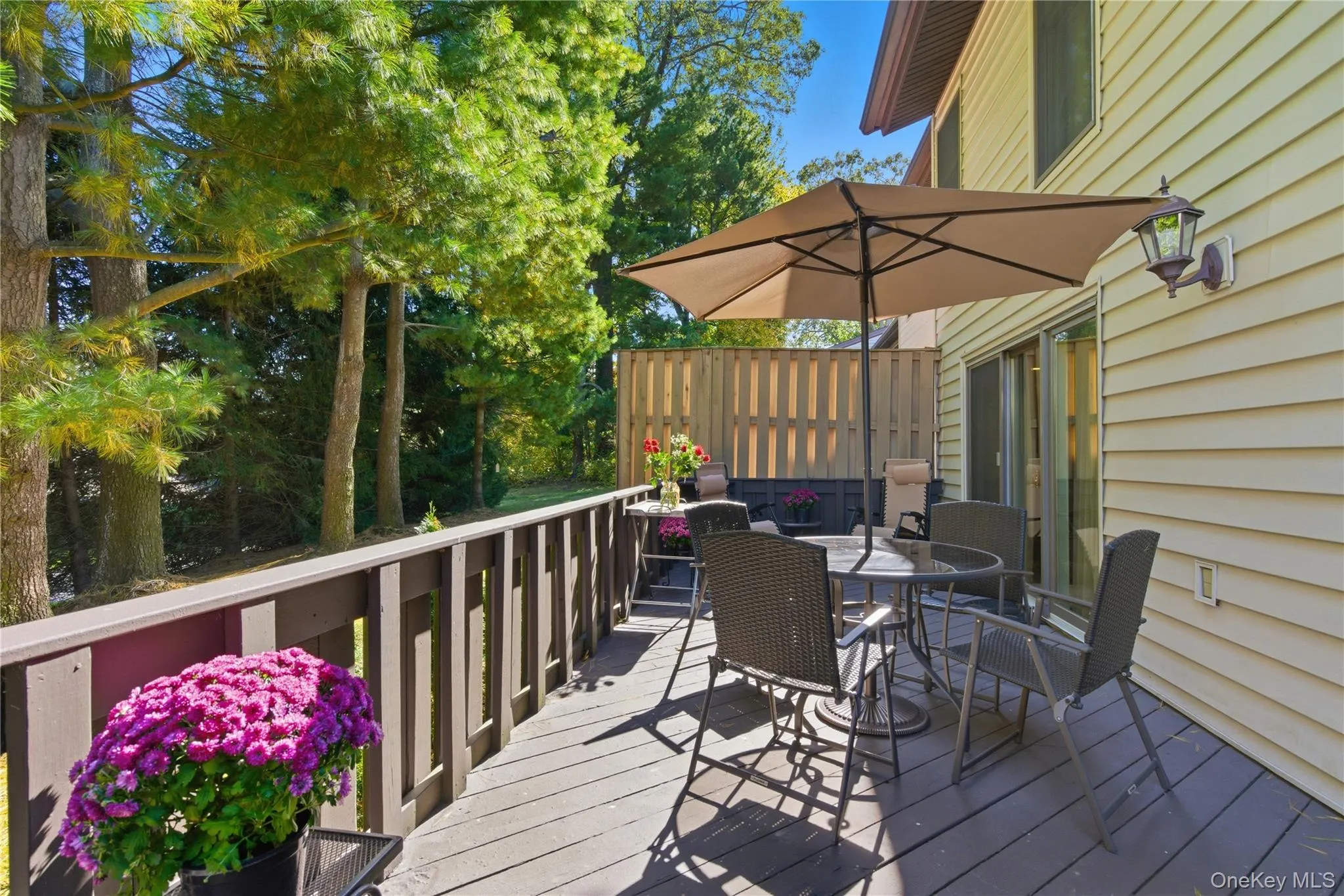 Inviting outdoor oasis featuring a private deck perfect for hosting unwinding. Inviting outdoor oasis featuring a private deck perfect for hosting unwinding.