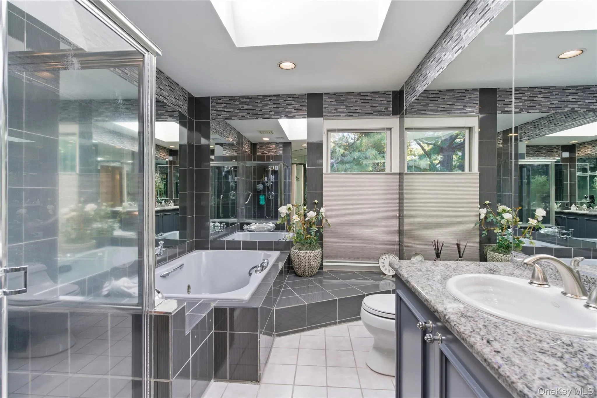 Spa-Like Primary Bath with Jacuzzi tuband double sink Spa-Like Primary Bath with Jacuzzi tuband double sink