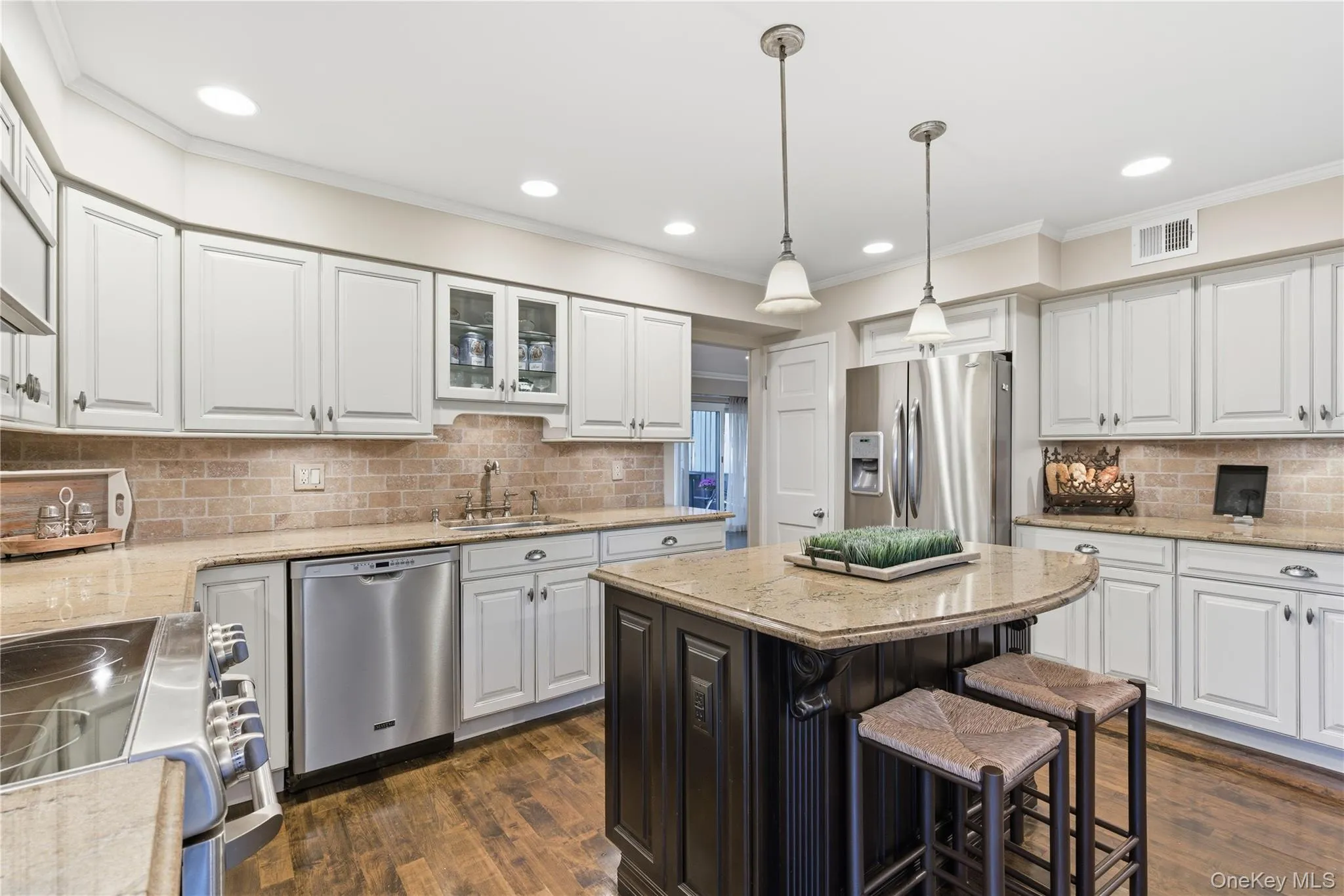 Sophisticated gourmet kitchen showcasing custom details Sophisticated gourmet kitchen showcasing custom details