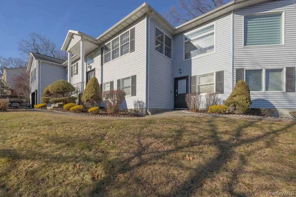 View of side of property with a yard View of side of property with a yard