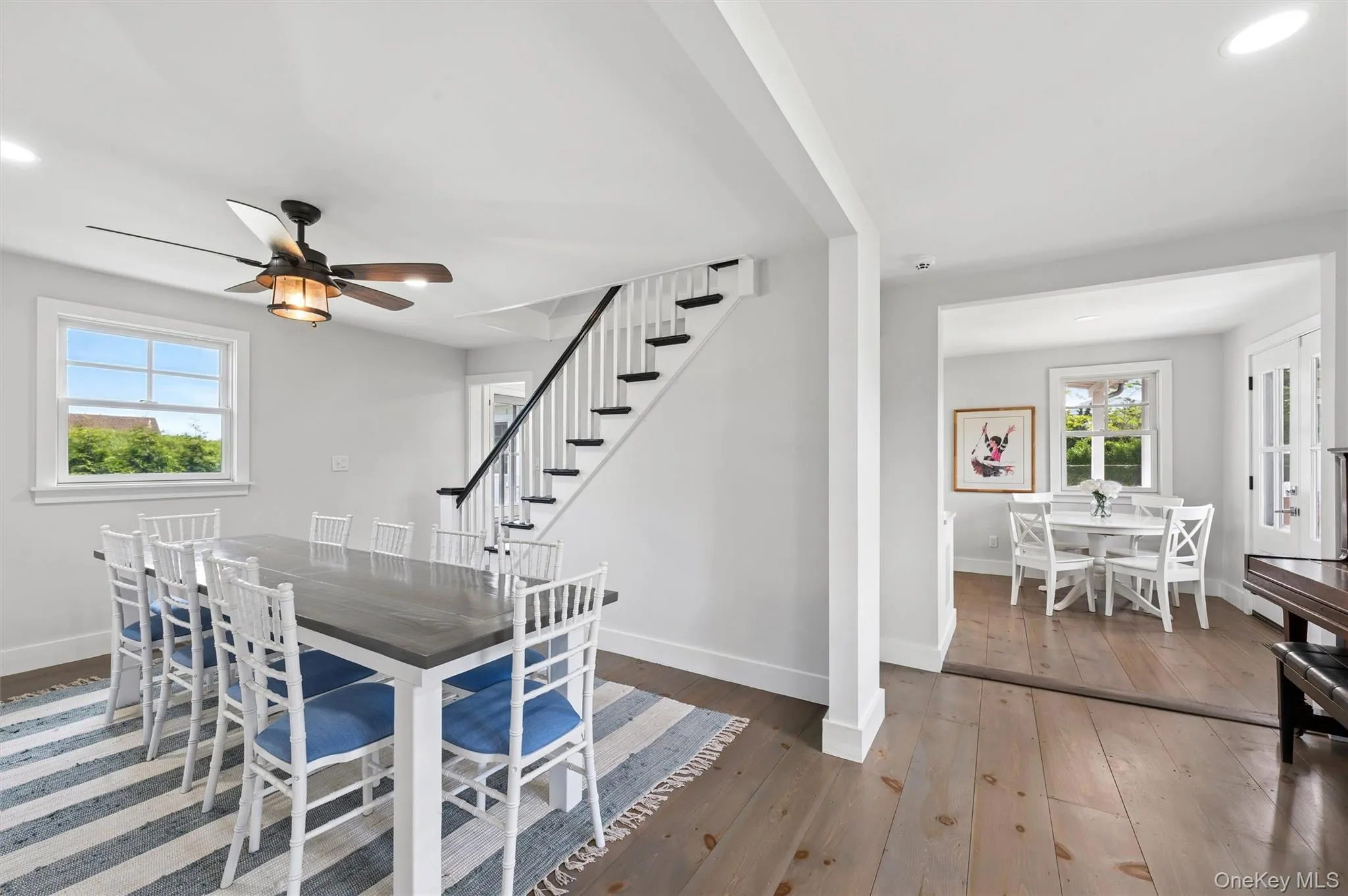 Staircase divides dining and kitchen areas. Staircase divides dining and kitchen areas.