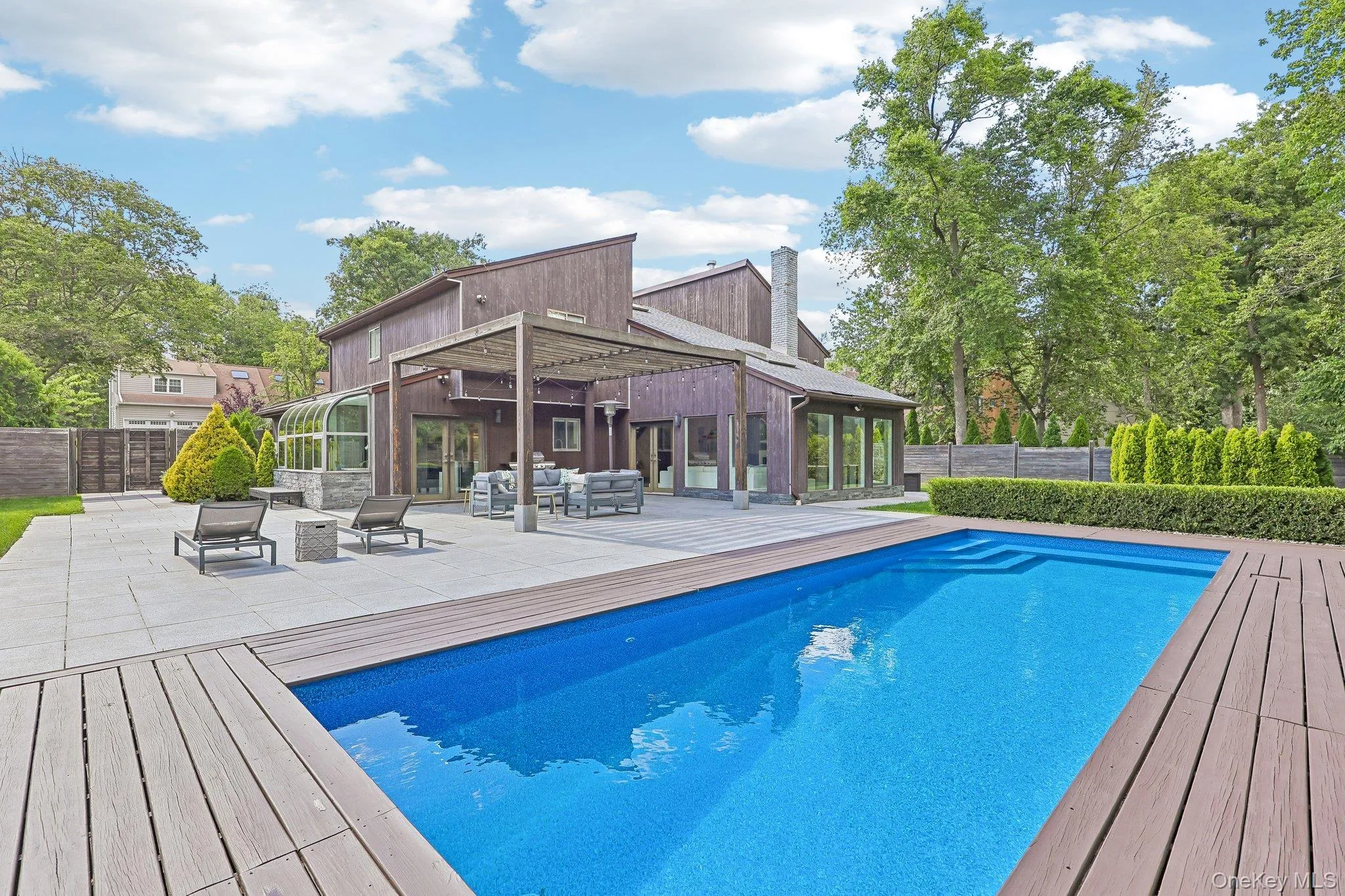 Infinity lap pool with wood decking Infinity lap pool with wood decking
