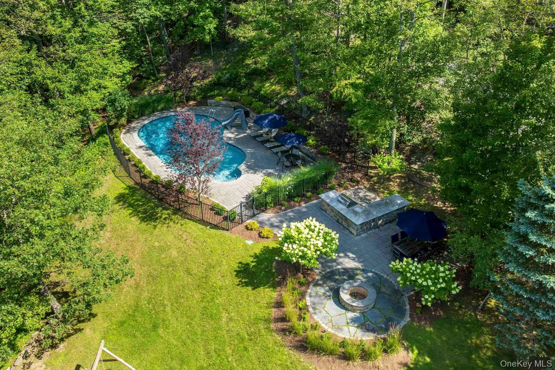 Drone / aerial view of a pool and patio Drone / aerial view of a pool and patio
