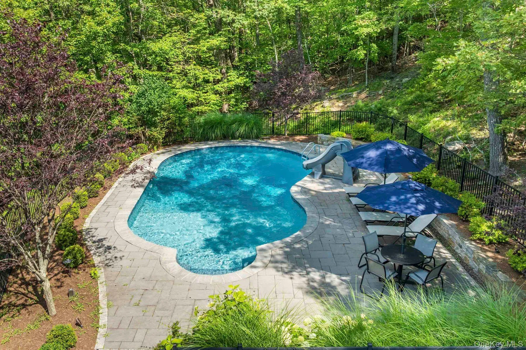 Pool with outdoor kitchen and fire pit. Pool with outdoor kitchen and fire pit.