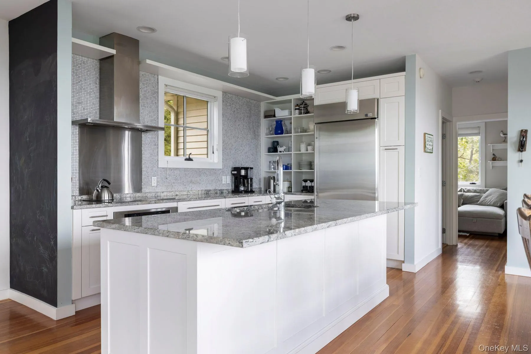 Kitchen with stainless steel appliances, island, and granite countertops Kitchen with stainless steel appliances, island, and granite countertops