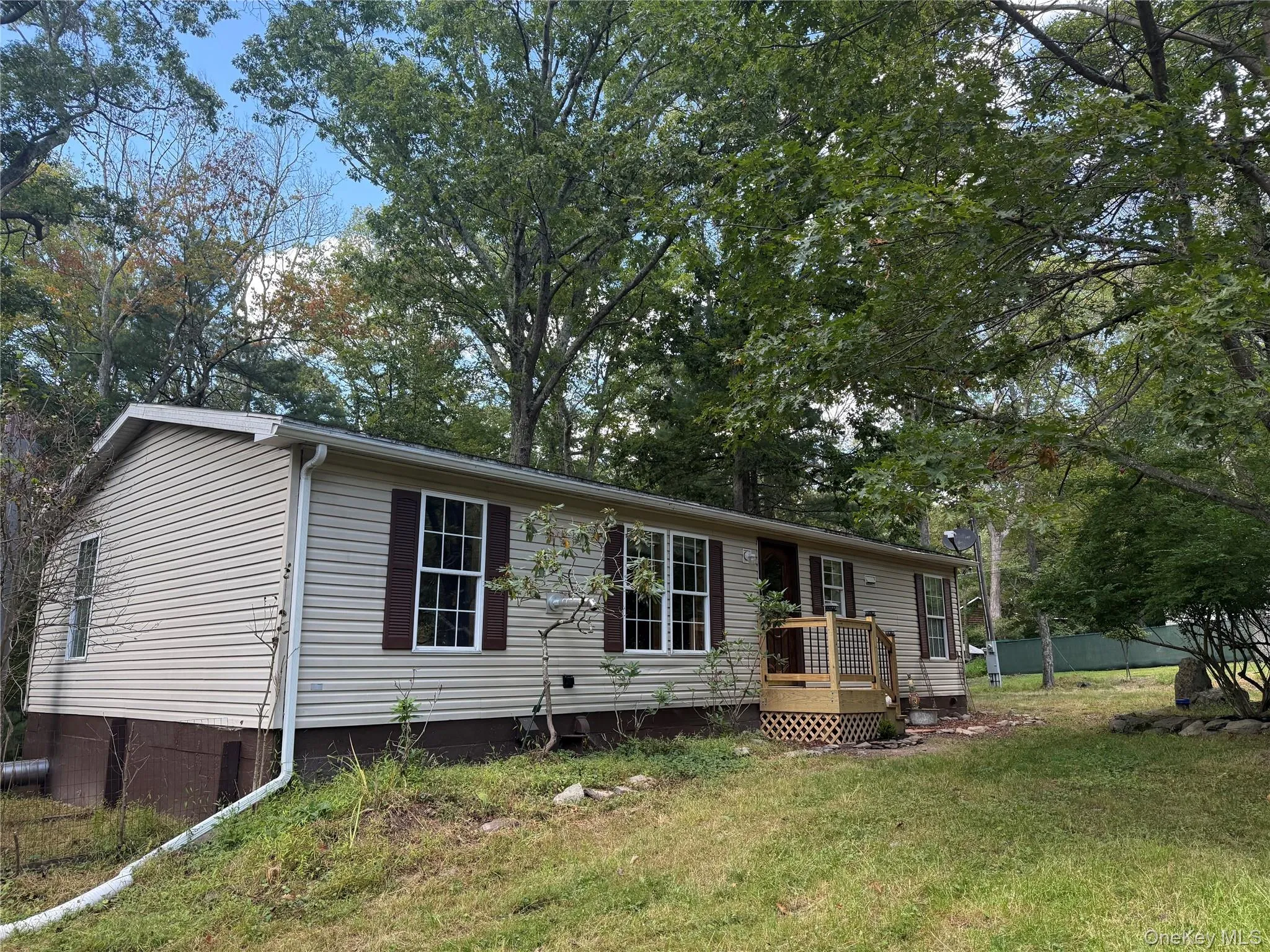 View of front of home with crawl space and a front yard View of front of home with crawl space and a front yard