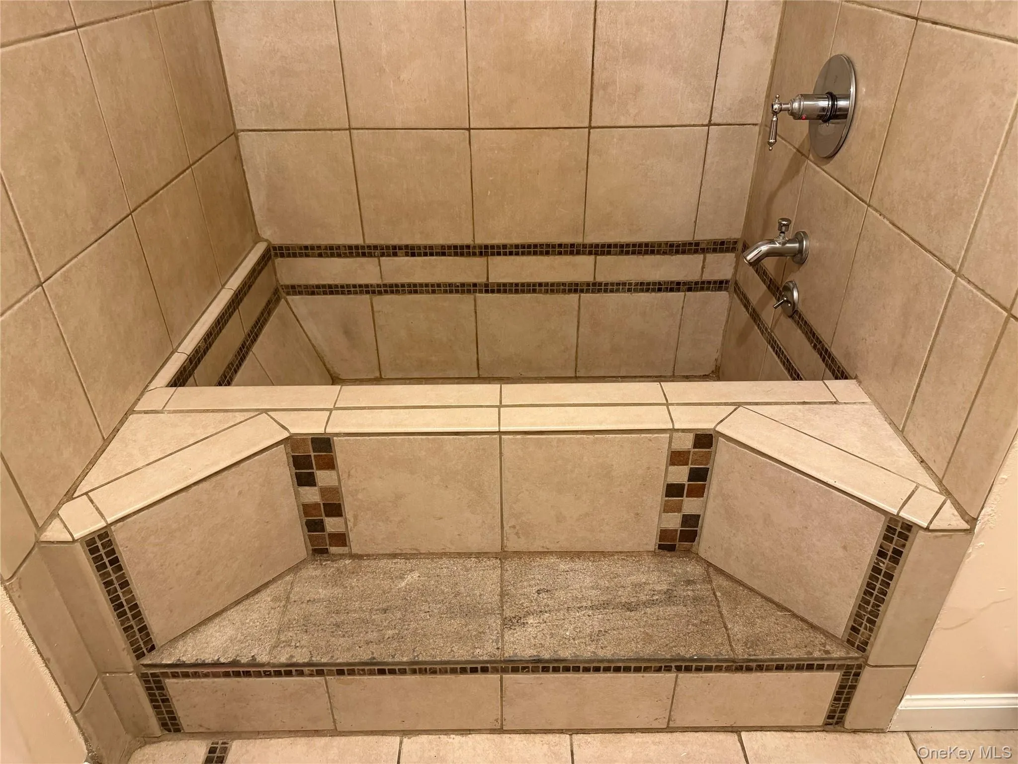 Bathroom view of a tile shower Bathroom view of a tile shower