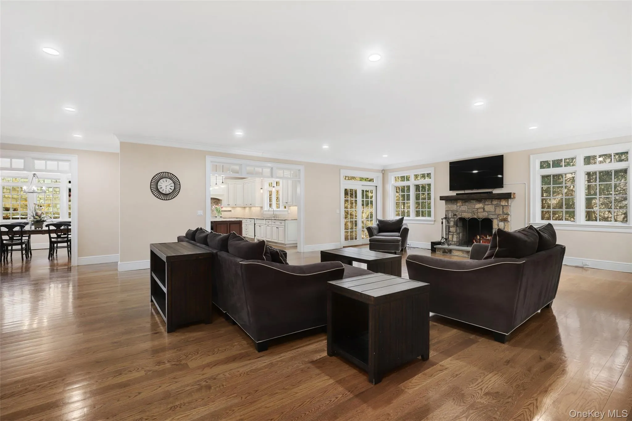 Living room with crown molding, a fireplace, hardwood flooring Living room with crown molding, a fireplace, hardwood flooring