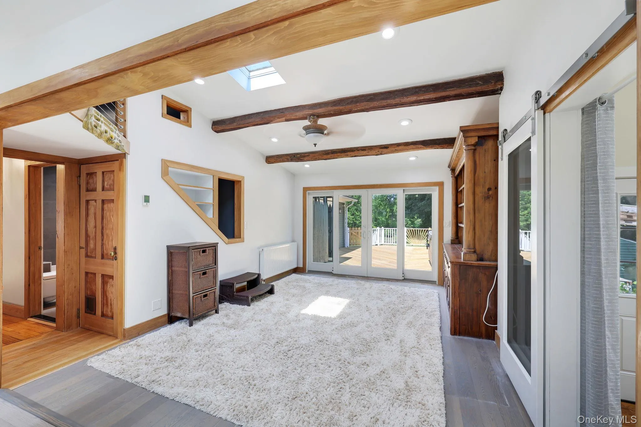 Generous size Family Room with sliding glass doors to back deck with jacuzzi and outdoor shower. Generous size Family Room with sliding glass doors to back deck with jacuzzi and outdoor shower.