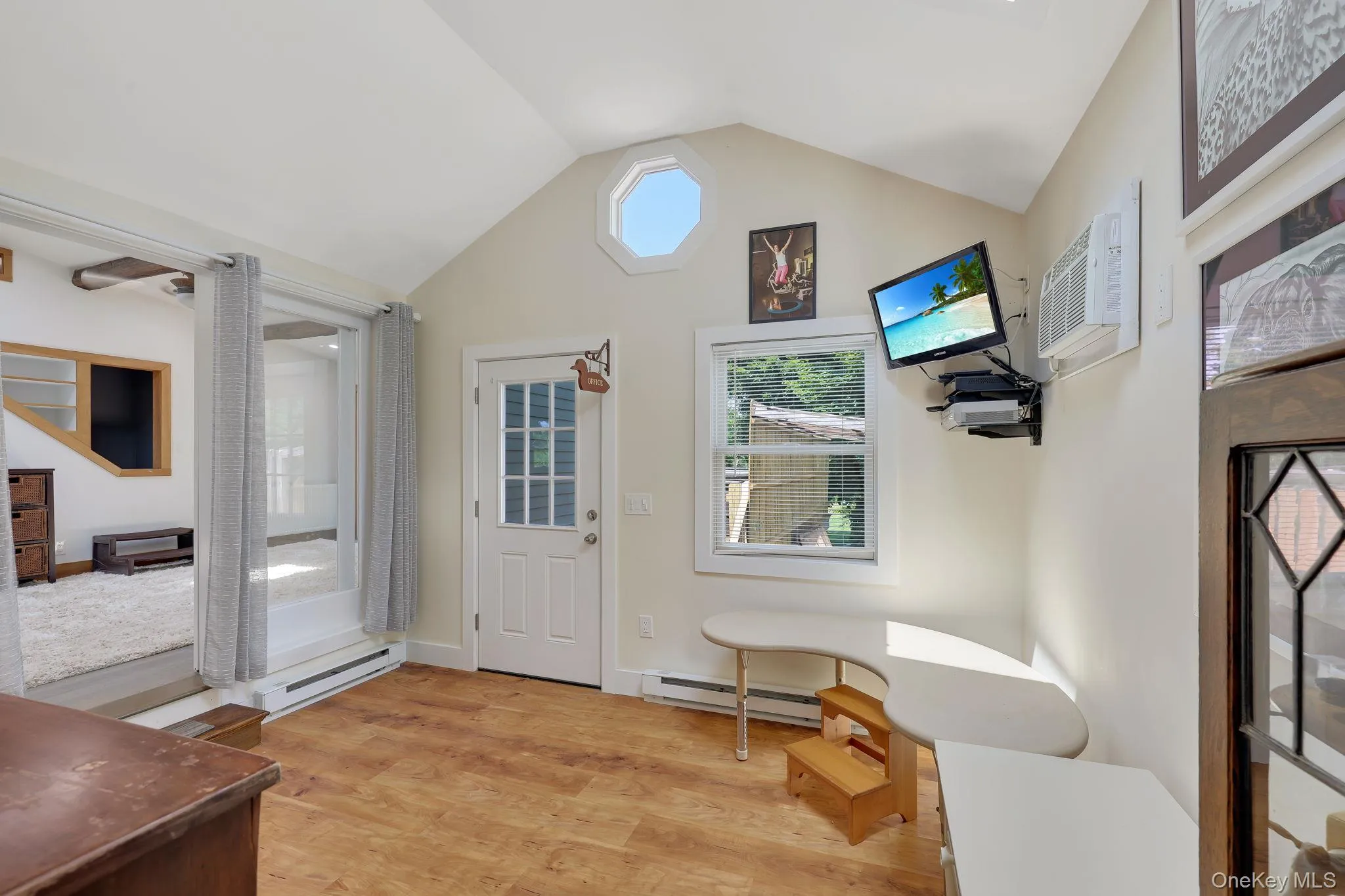 Home Office with separate entrance off back deck. Home Office with separate entrance off back deck.