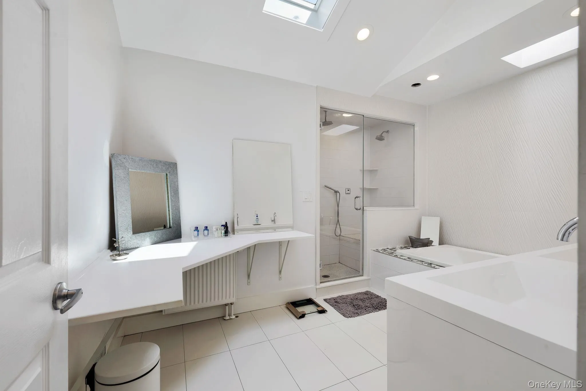 Primary Bedroom En Suite - Plenty of counter space, double vanity and radiant heated tile floor. Primary Bedroom En Suite - Plenty of counter space, double vanity and radiant heated tile floor.