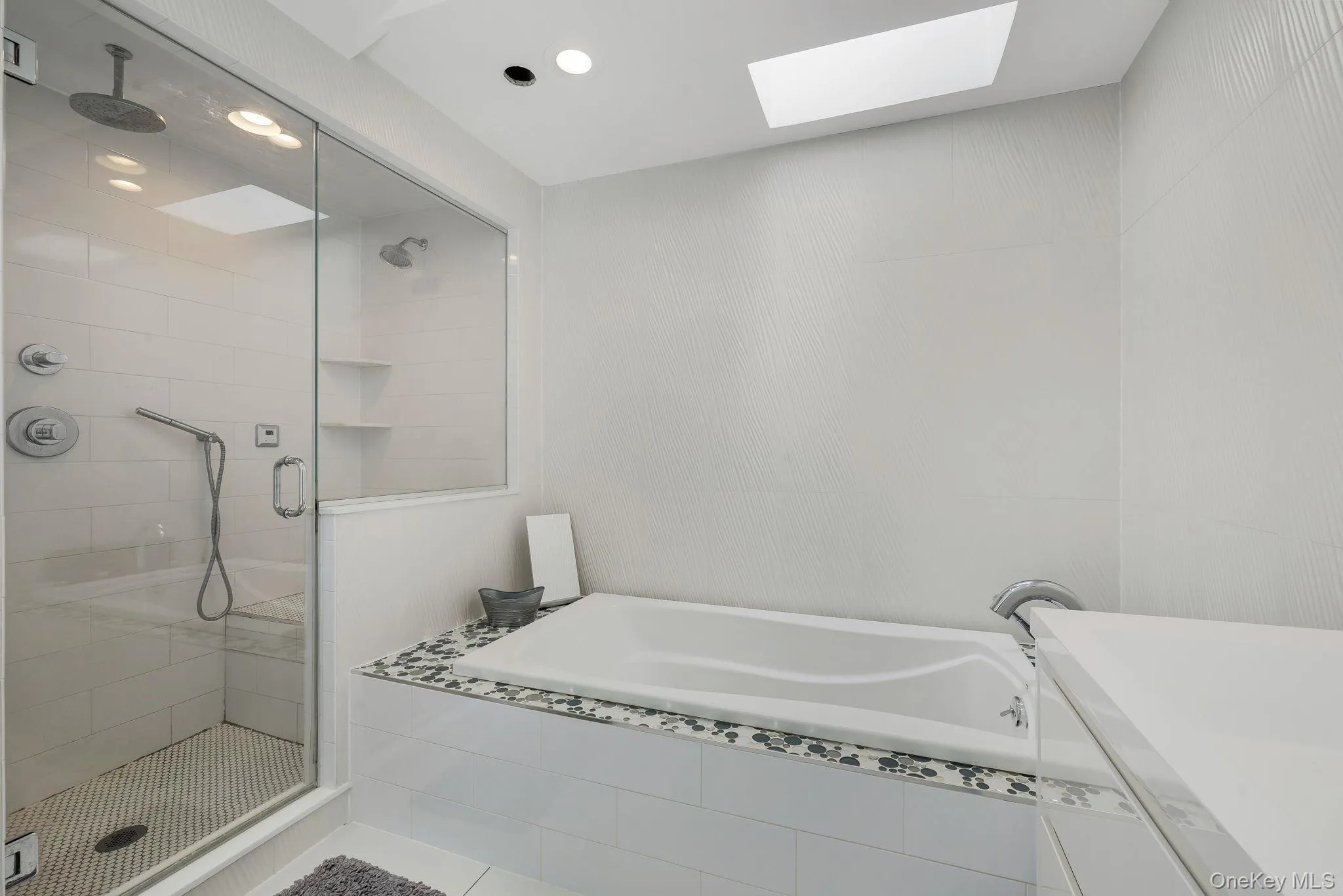 Primary En Suite Walk in Shower with ceiling mounted rain shower head, built in steam unit and whirlpool soaking tub Primary En Suite Walk in Shower with ceiling mounted rain shower head, built in steam unit and whirlpool soaking tub