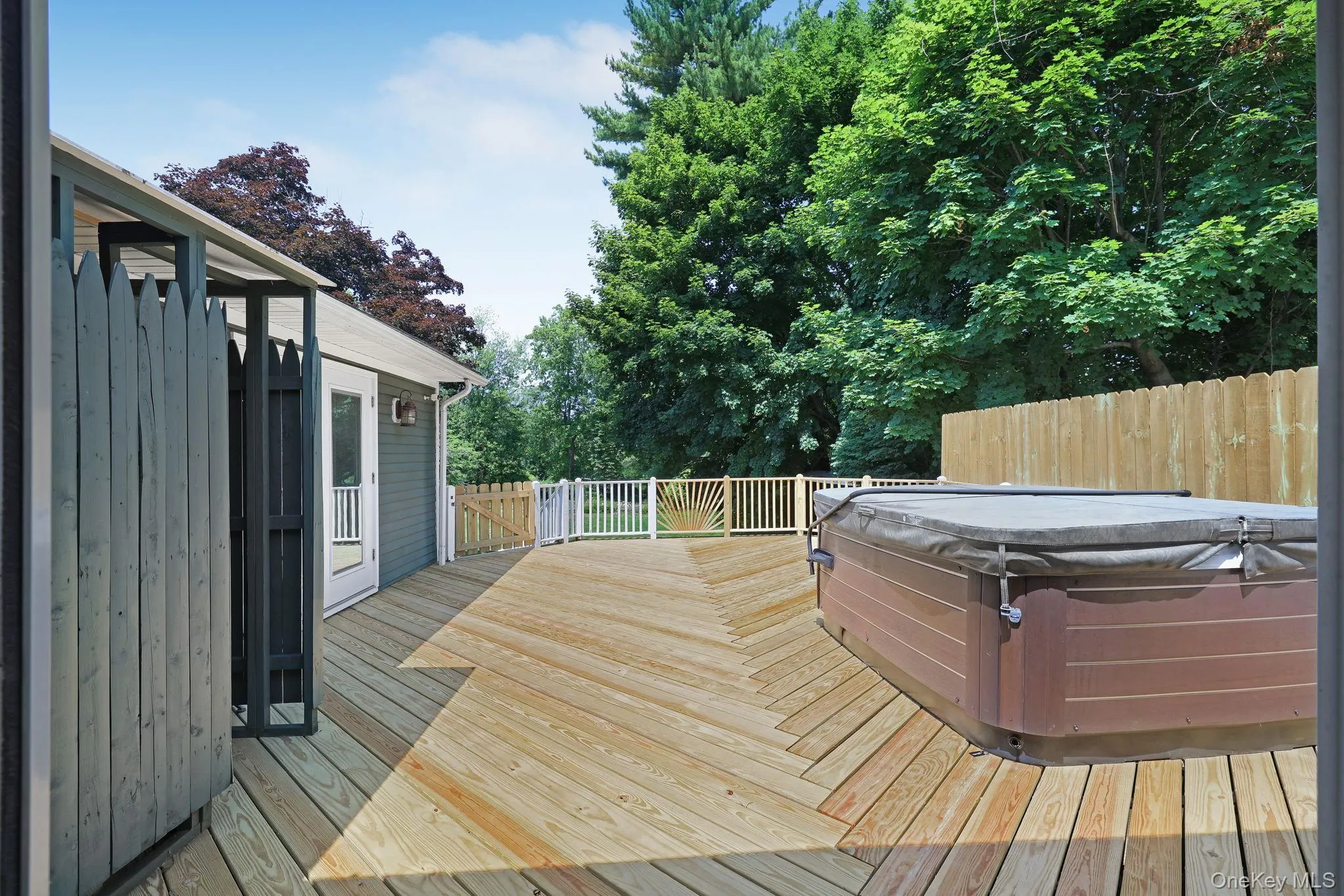Private Back Deck with Hot Tub and outdoor shower Private Back Deck with Hot Tub and outdoor shower
