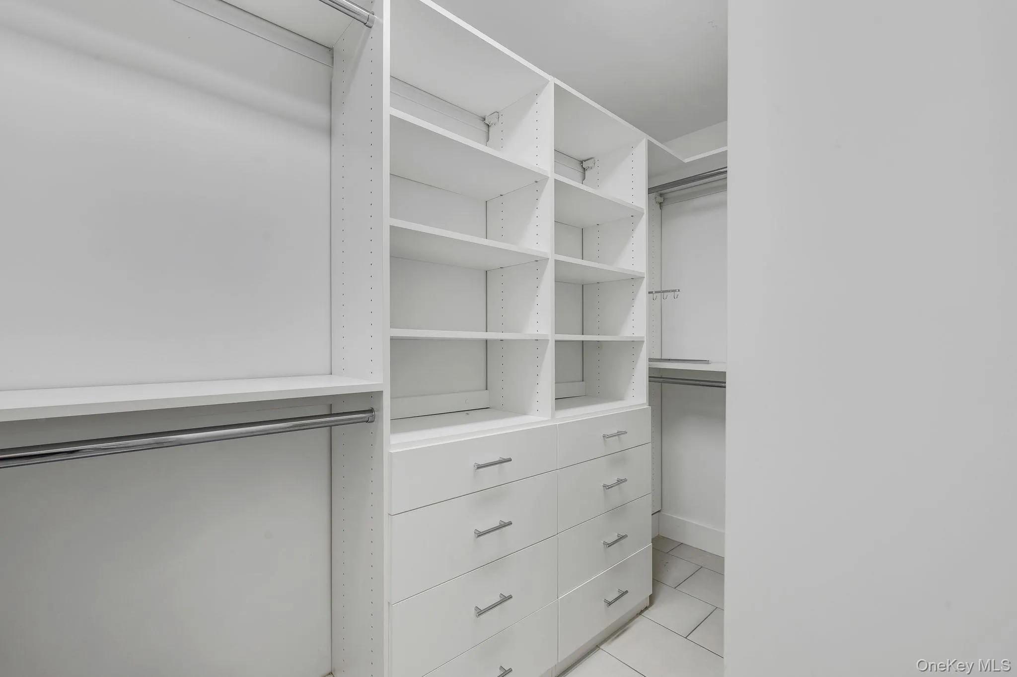 Primary Bedroom walk in closet with built in's and radiant heated floor Primary Bedroom walk in closet with built in's and radiant heated floor