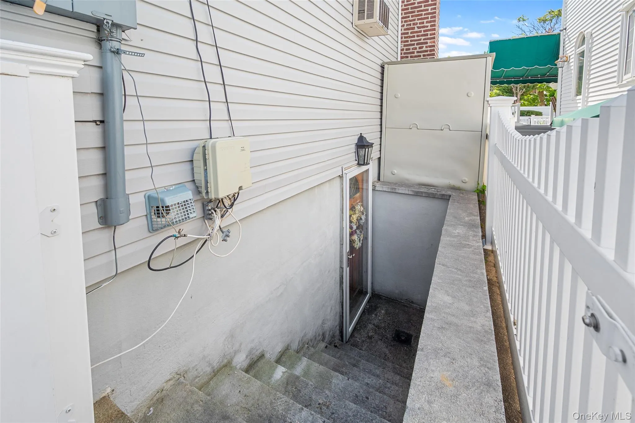 Outside separate entrance to basement. Outside separate entrance to basement.