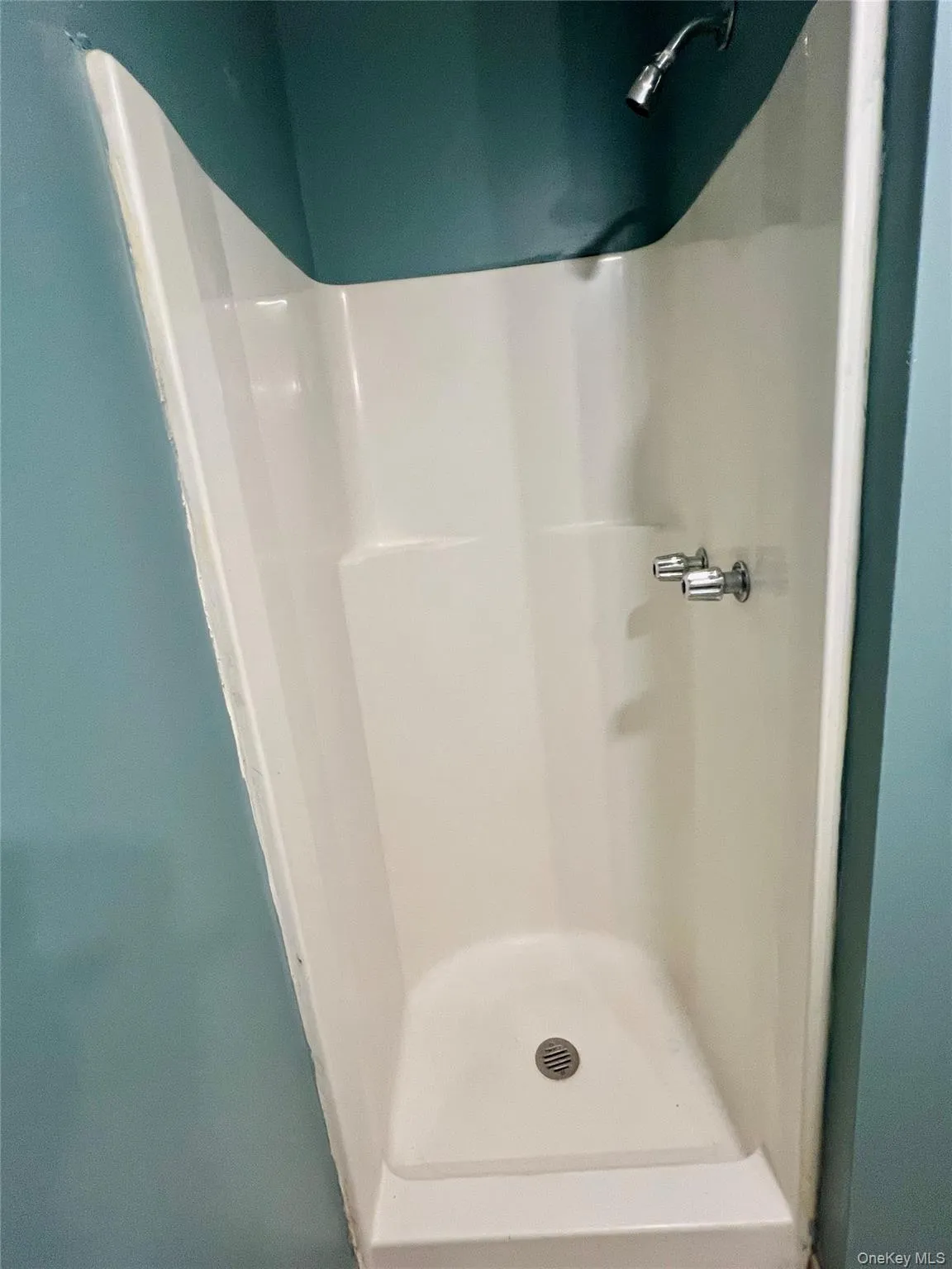 Full bathroom with a shower stall Full bathroom with a shower stall