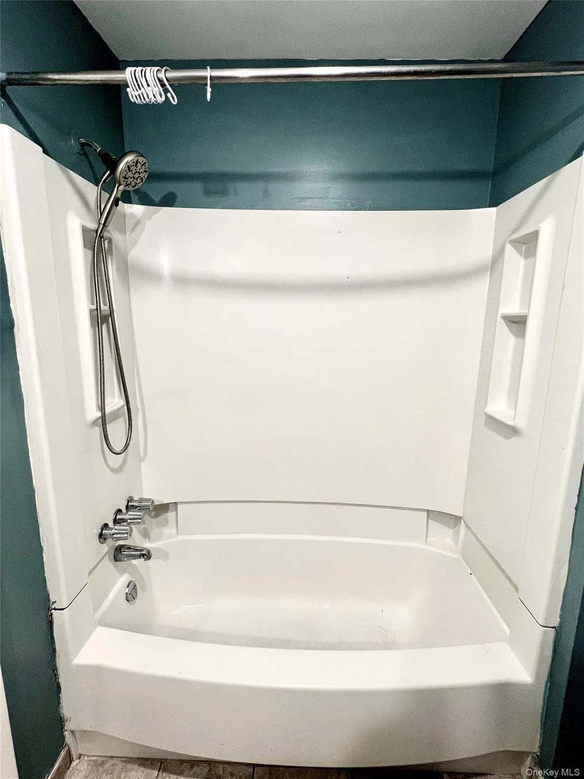 Bathroom with shower combination and tile patterned flooring Bathroom with shower combination and tile patterned flooring