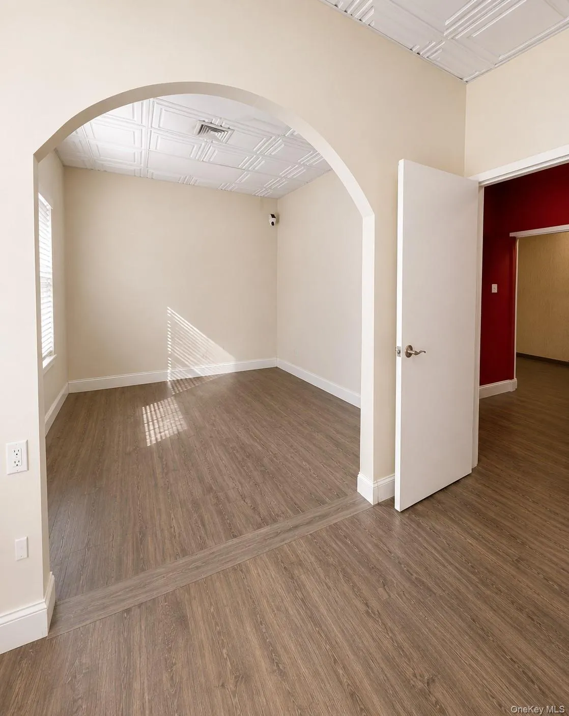 Arched doorway leading to a second half of office space #1. Arched doorway leading to a second half of office space #1.