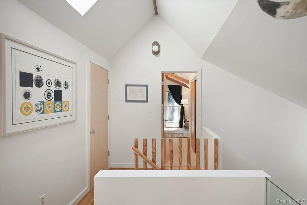 Head up the wooden staircase to the second-floor landing, where you’ll find two bedrooms, a full bath, and a roomy storage closet. A skylight brightens the space from above. Head up the wooden staircase to the second-floor landing, where you’ll find two bedrooms, a full bath, and a roomy storage closet. A skylight brightens the space from above.