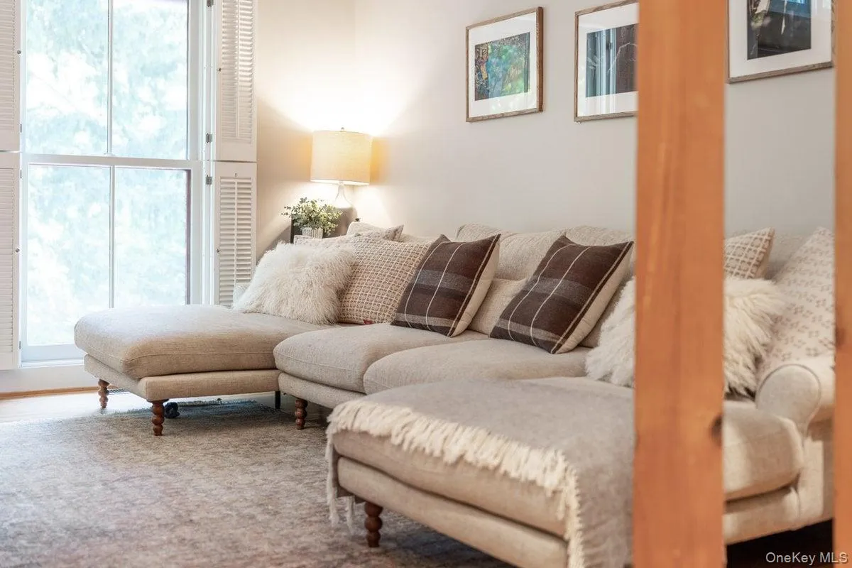Floor-to-ceiling windows with custom shutters are standout features of the den. Floor-to-ceiling windows with custom shutters are standout features of the den.