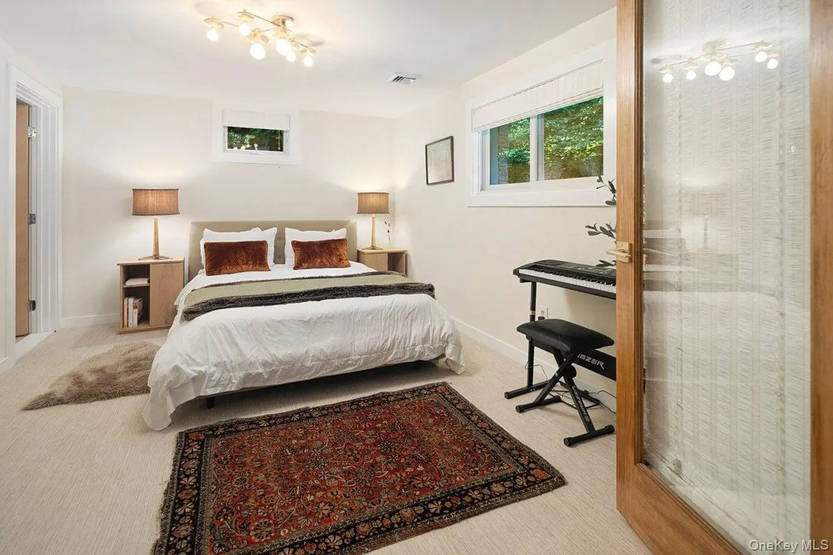 Additional view of the bonus room, featuring windows and access to an en suite bath. Additional view of the bonus room, featuring windows and access to an en suite bath.