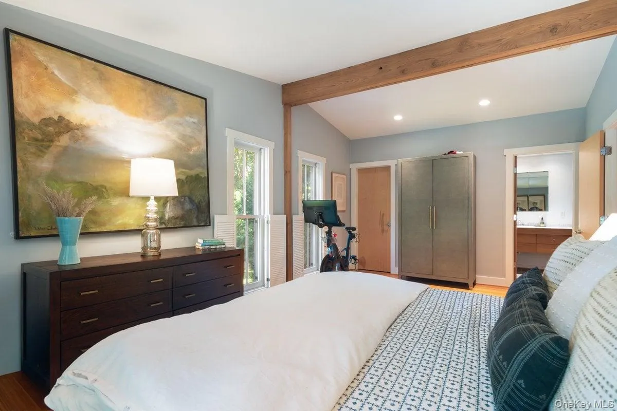 A walk-in closet and en suite bath enhance the charm of the primary bedroom. A walk-in closet and en suite bath enhance the charm of the primary bedroom.