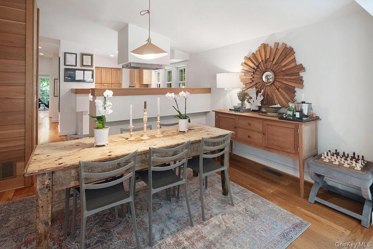 The spacious dining room, open to the living area and kitchen, is perfect for casual dinners and large holiday gatherings. The spacious dining room, open to the living area and kitchen, is perfect for casual dinners and large holiday gatherings.