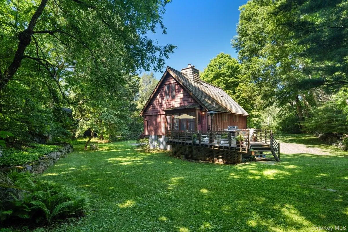 A spacious yard, perfect for playing or gardening, surrounds the home. The back deck is immersed in natural beauty and offers privacy, making indoor-outdoor living at its finest. A spacious yard, perfect for playing or gardening, surrounds the home. The back deck is immersed in natural beauty and offers privacy, making indoor-outdoor living at its finest.