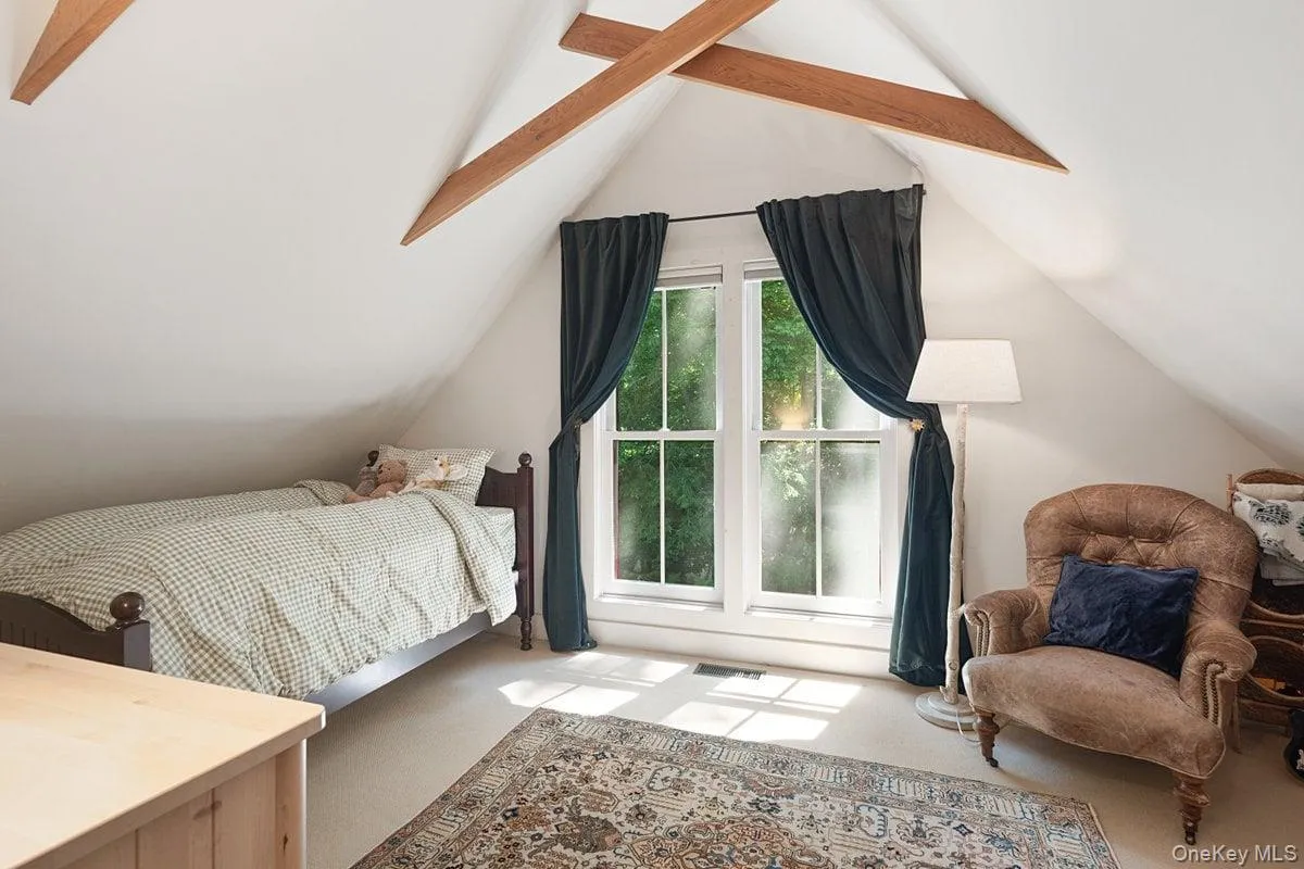 Bedroom 3 on the second floor boasts wood vaulted ceilings, large windows, and two spacious closets. Bedroom 3 on the second floor boasts wood vaulted ceilings, large windows, and two spacious closets.